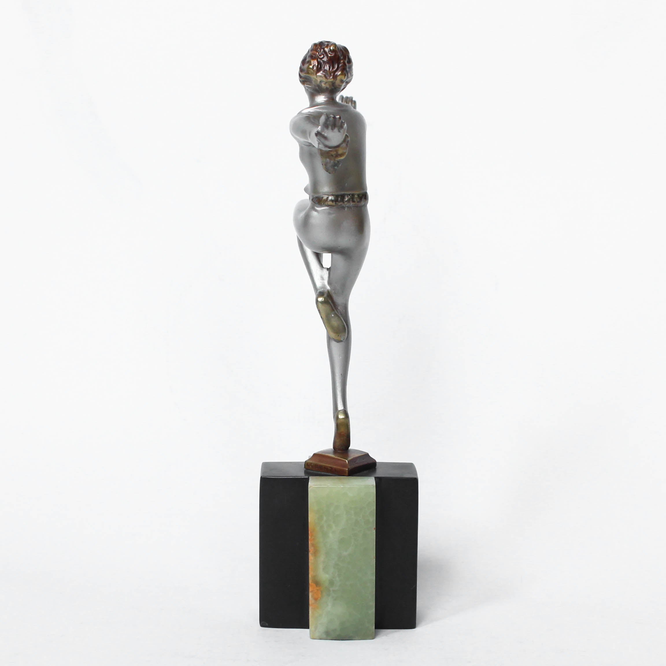 An Art Deco, cold painted bronze figure by Josef Lorenzl (1892-1950). A dancing woman in stylised pose set over a green onyx plinth at Jeroen Markies