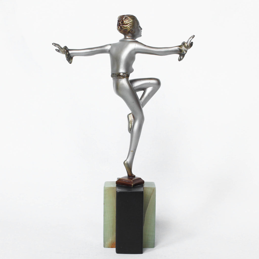 An Art Deco, cold painted bronze figure by Josef Lorenzl (1892-1950). A dancing woman in stylised pose set over a green onyx plinth at Jeroen Markies