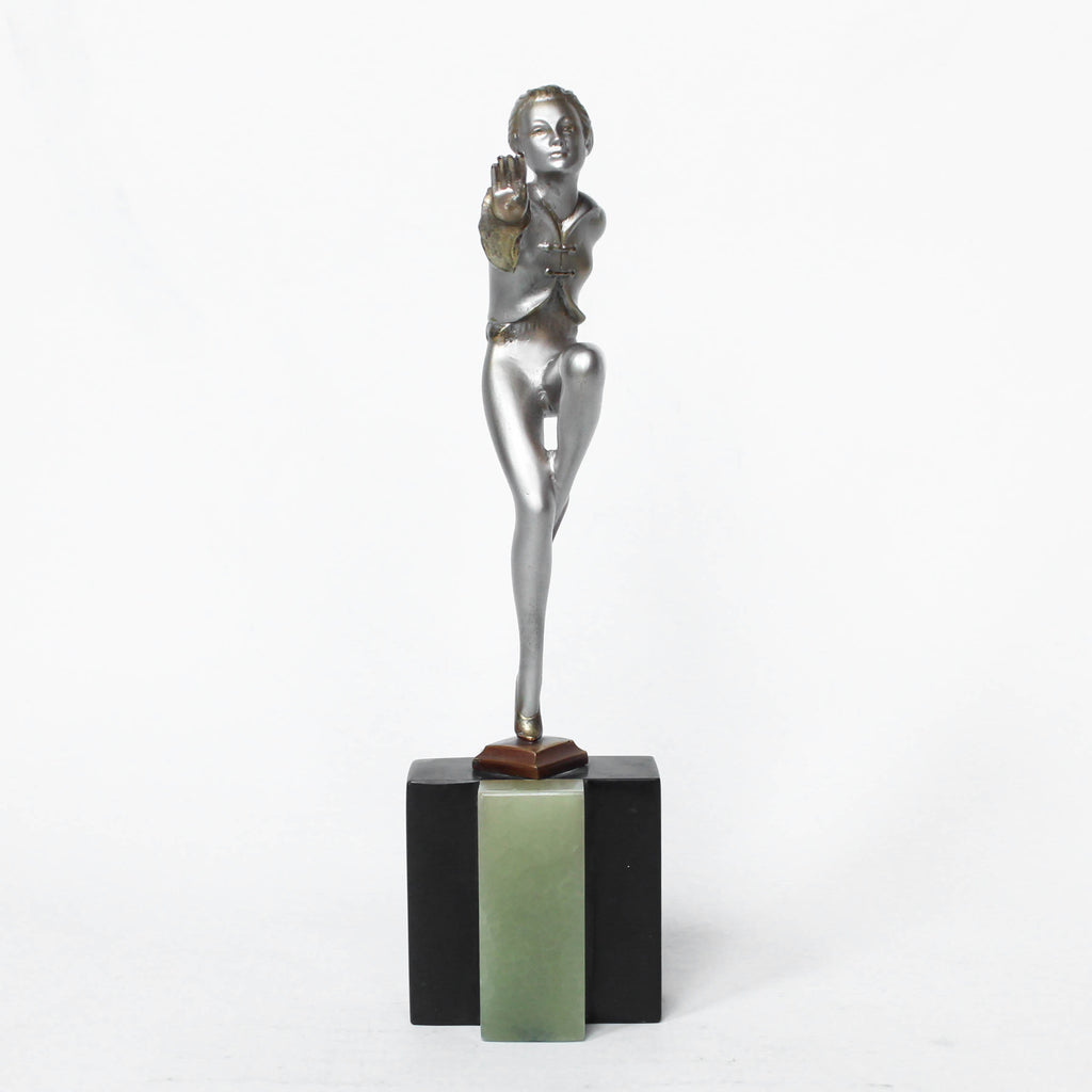 An Art Deco, cold painted bronze figure by Josef Lorenzl (1892-1950). A dancing woman in stylised pose set over a green onyx plinth at Jeroen Markies
