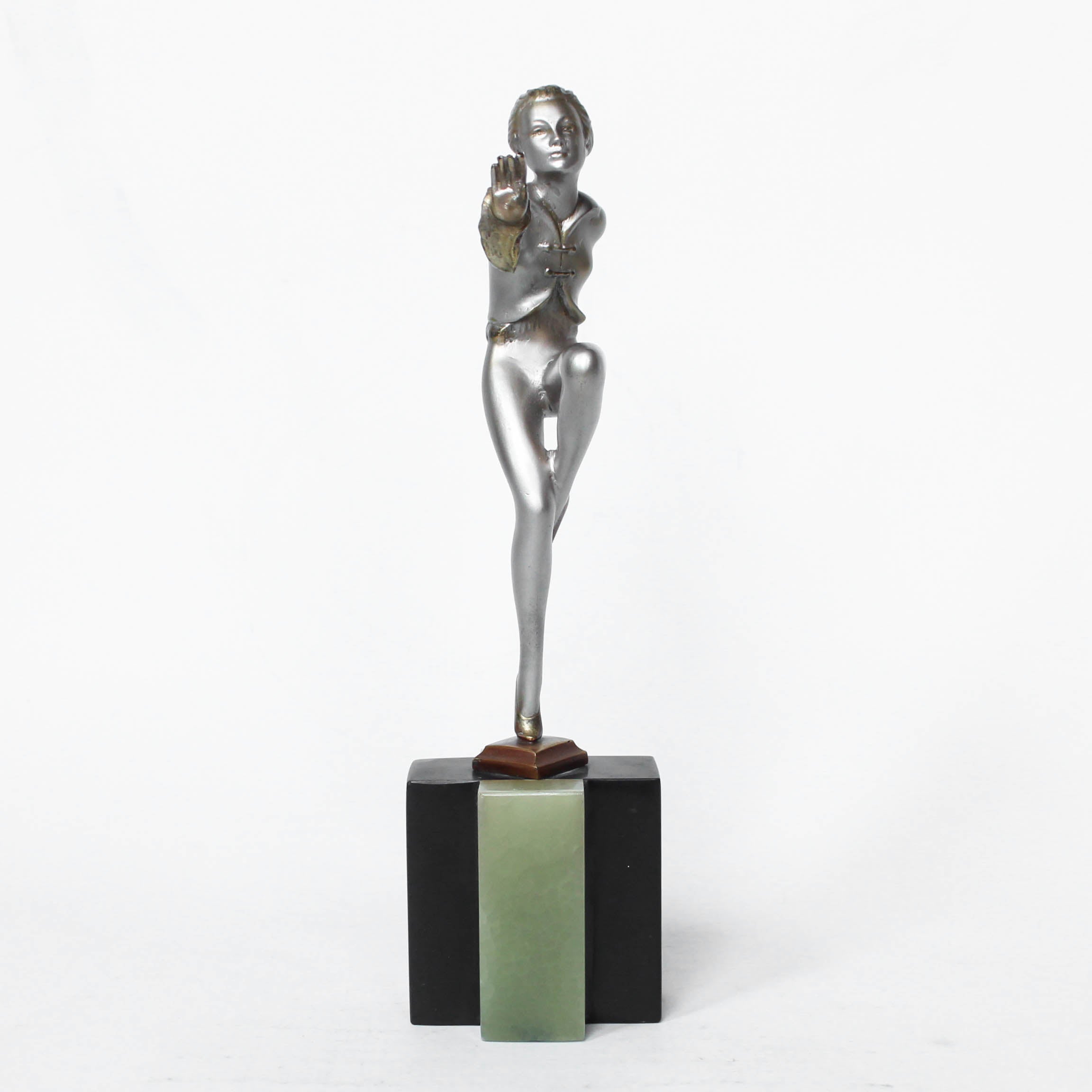 An Art Deco, cold painted bronze figure by Josef Lorenzl (1892-1950). A dancing woman in stylised pose set over a green onyx plinth at Jeroen Markies