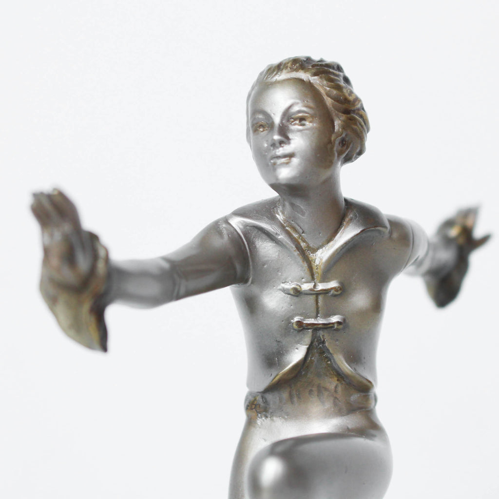 An Art Deco, cold painted bronze figure by Josef Lorenzl (1892-1950). A dancing woman in stylised pose set over a green onyx plinth at Jeroen Markies