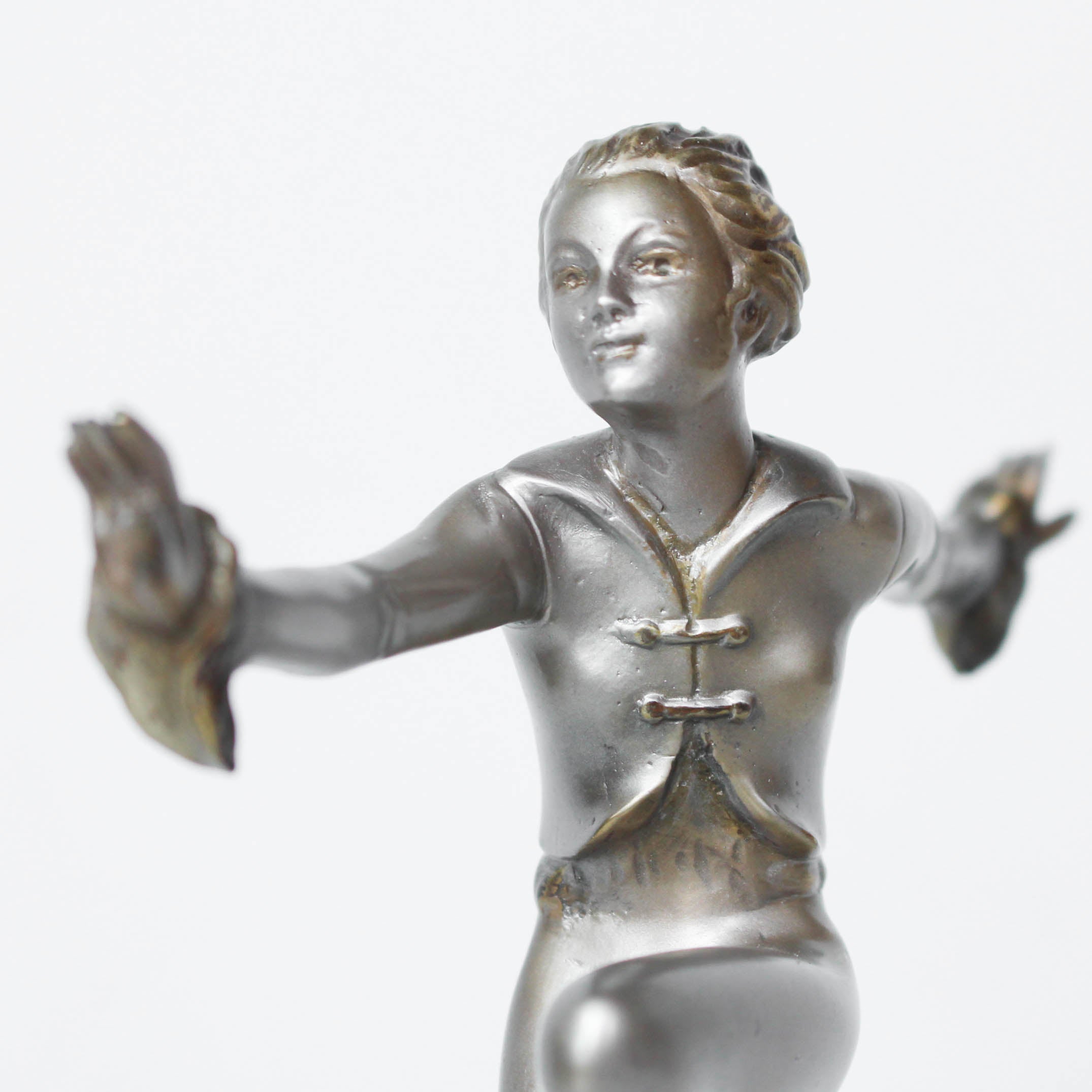 An Art Deco, cold painted bronze figure by Josef Lorenzl (1892-1950). A dancing woman in stylised pose set over a green onyx plinth at Jeroen Markies