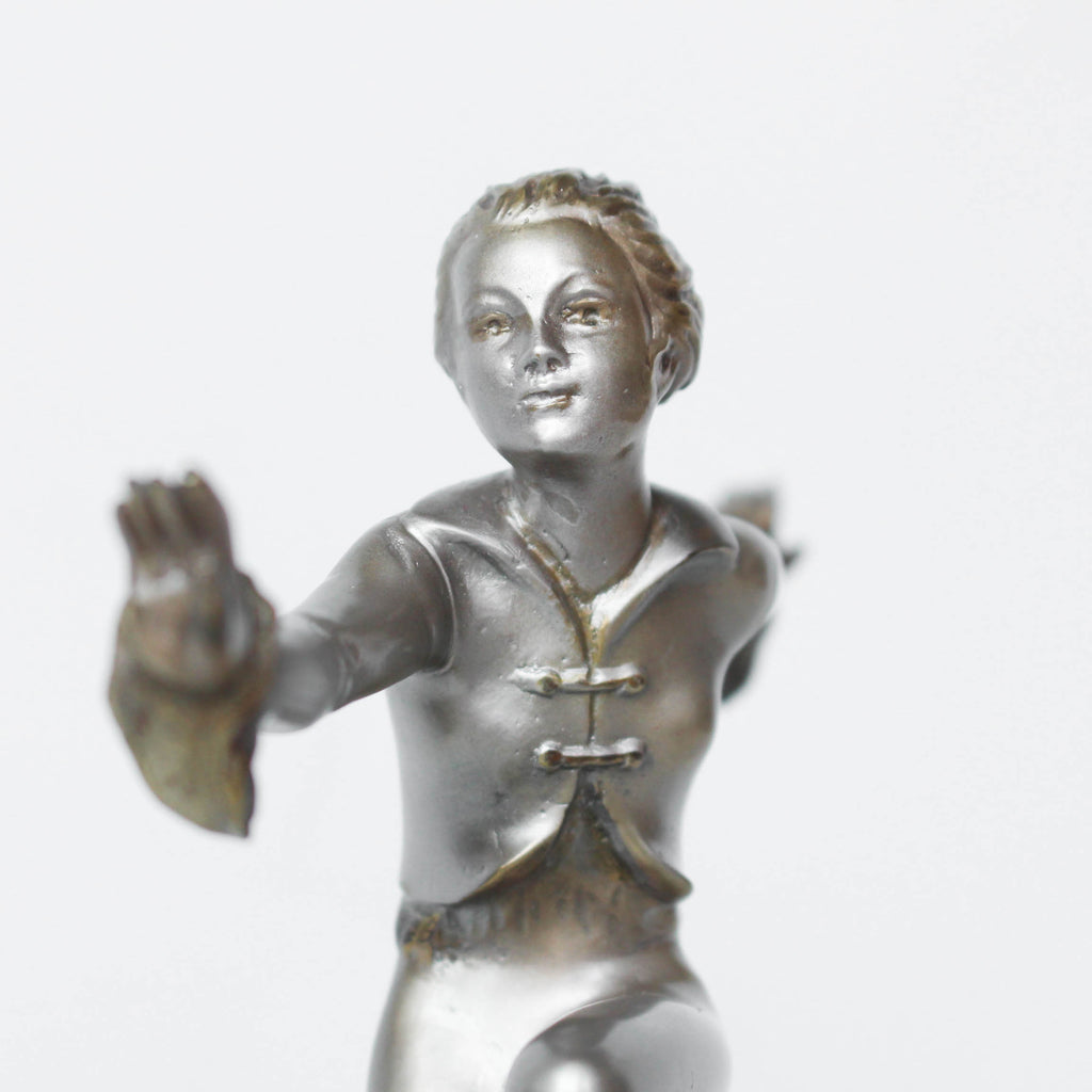 An Art Deco, cold painted bronze figure by Josef Lorenzl (1892-1950). A dancing woman in stylised pose set over a green onyx plinth at Jeroen Markies