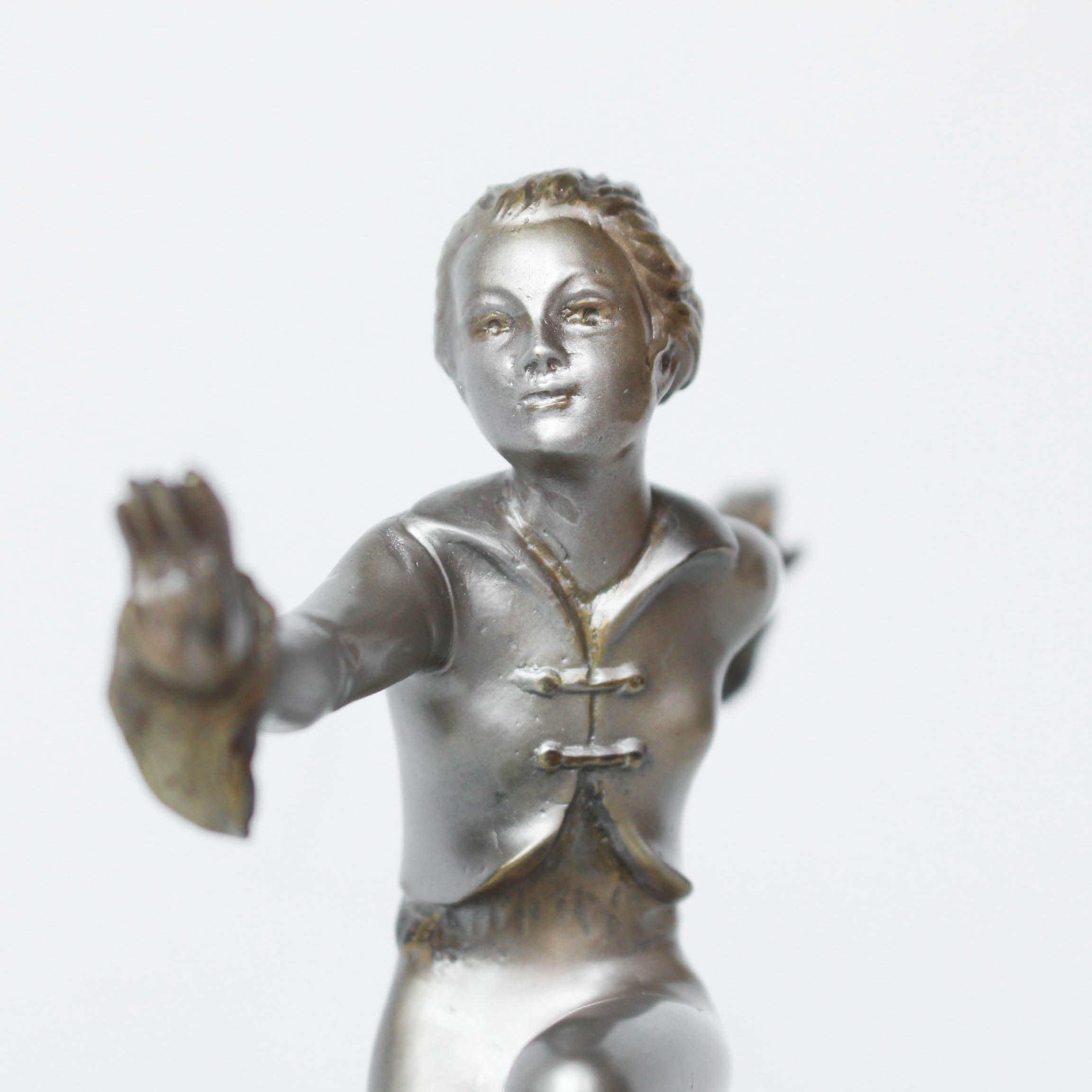 An Art Deco, cold painted bronze figure by Josef Lorenzl (1892-1950). A dancing woman in stylised pose set over a green onyx plinth at Jeroen Markies