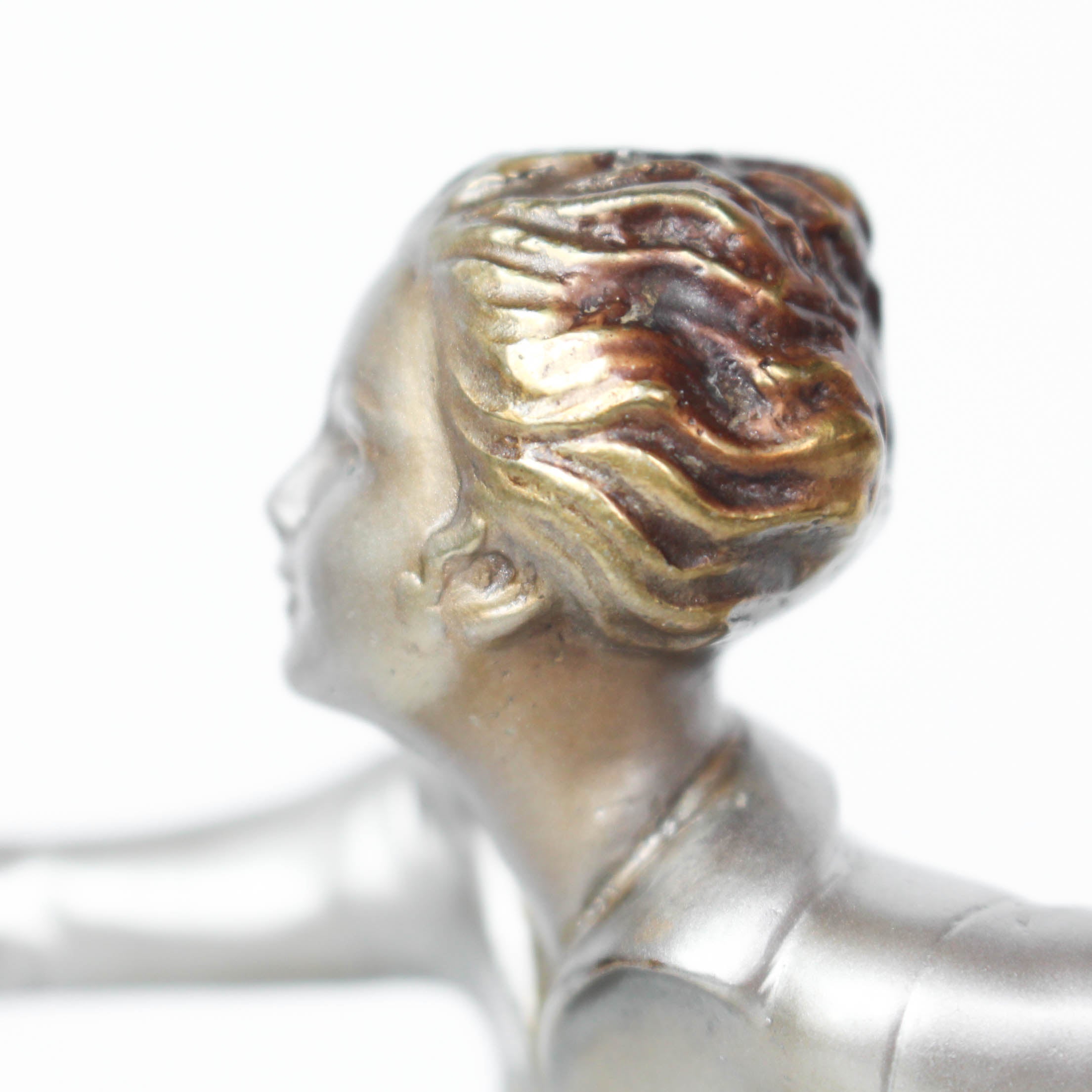 An Art Deco, cold painted bronze figure by Josef Lorenzl (1892-1950). A dancing woman in stylised pose set over a green onyx plinth at Jeroen Markies