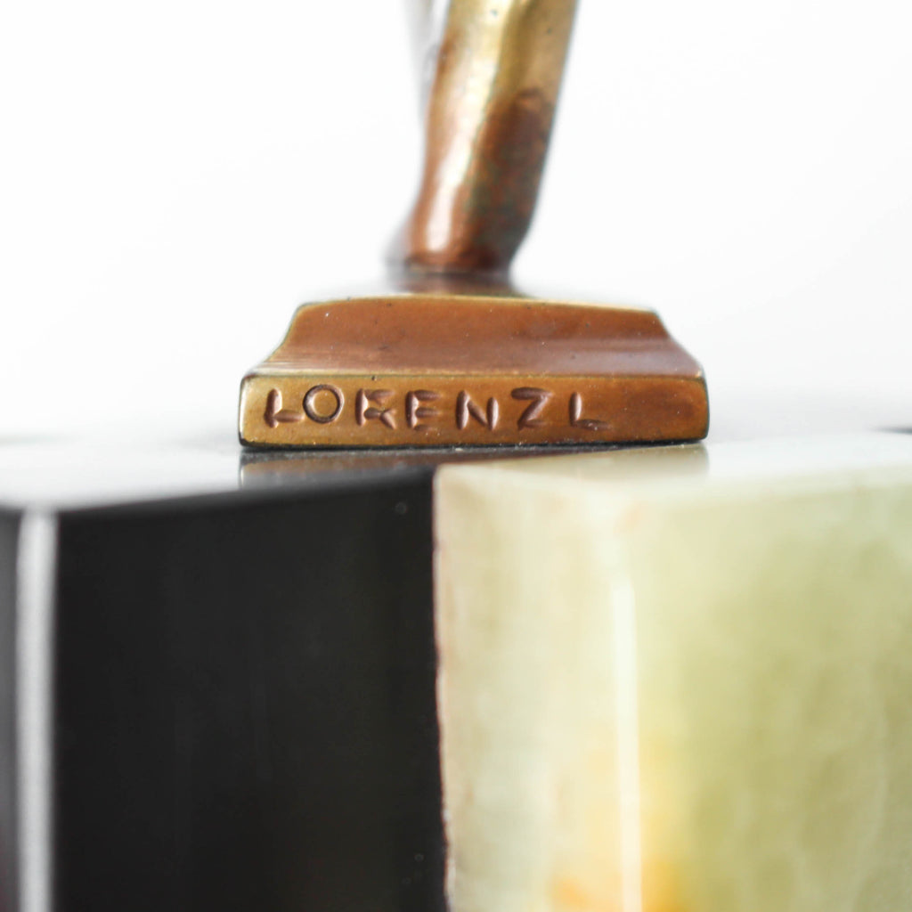 An Art Deco, cold painted bronze figure by Josef Lorenzl (1892-1950). A dancing woman in stylised pose set over a green onyx plinth at Jeroen Markies