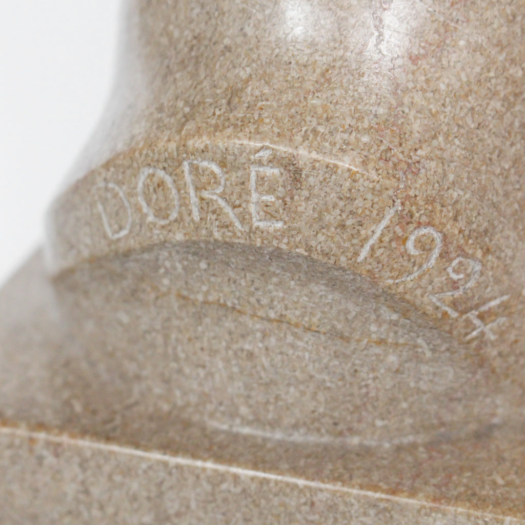 An Art Deco, stone carved sculpture of a smiling young lady, set over an integral plinth. Original dedication plaque to rear at Jeroen Markies.