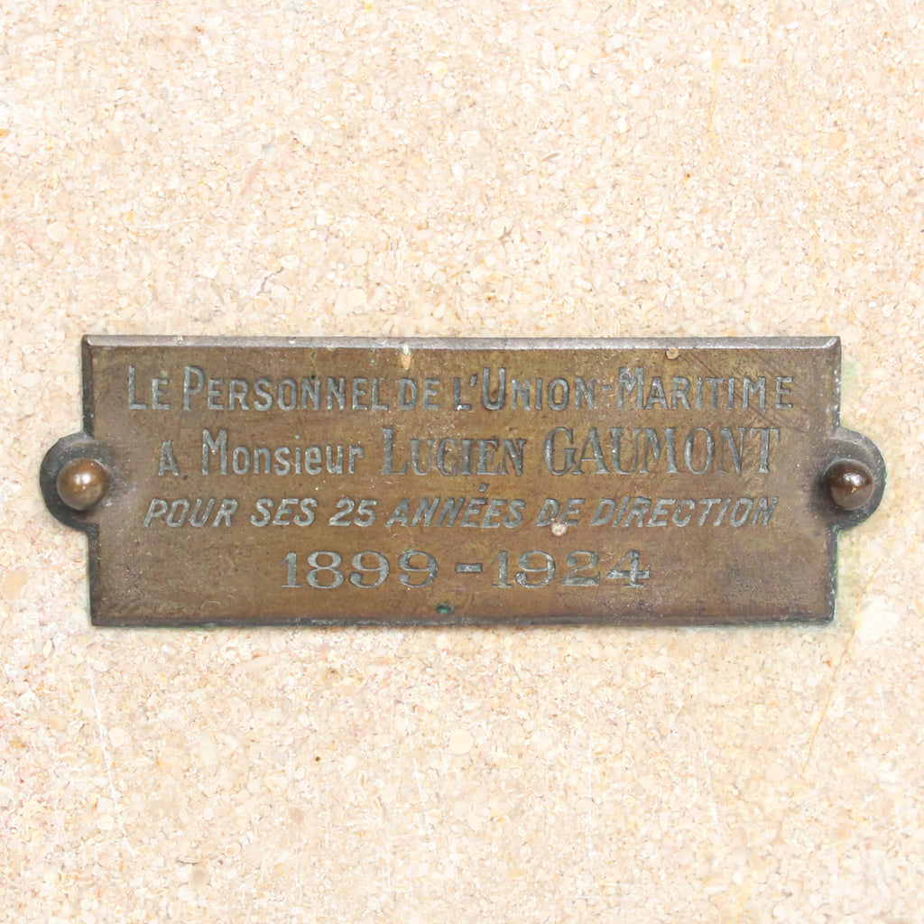 An Art Deco, stone carved sculpture of a smiling young lady, set over an integral plinth. Original dedication plaque to rear at Jeroen Markies.