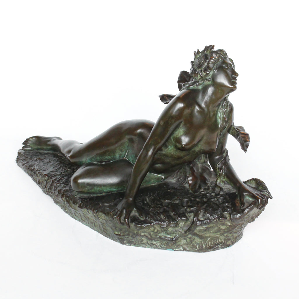 Clytie, a verdigris patinated bronze sculpture by François Louis Virieux (19th and 20thC). Depicts Clytie, the nymph infatuated with Helios, god of the sun. She eventually became a sunflower because, like the flower, she followed her unrequited love with her gaze wherever he went at Jeroen Markies.