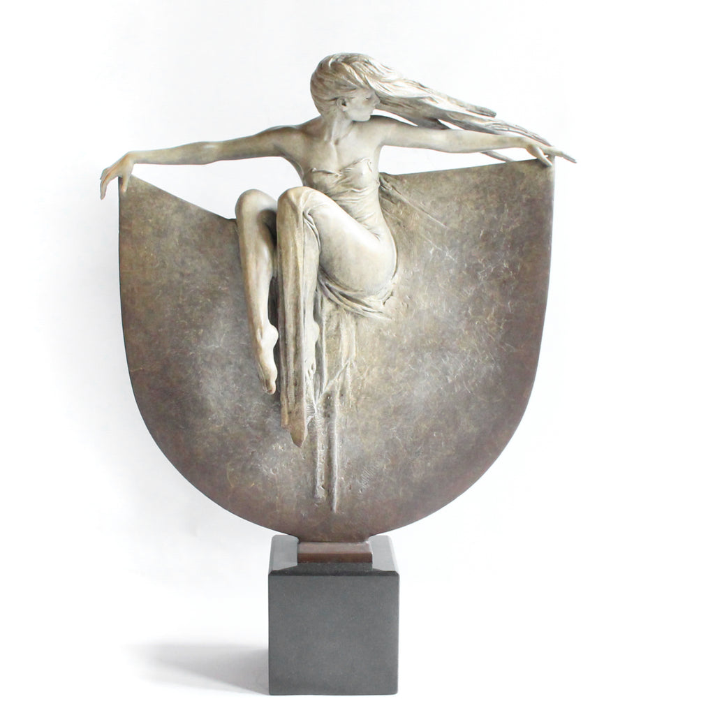 Grace, a limited edition, patinated bronze figure of a dancer in draping robe. Set over a granite plinth.  After completing a Masters degree at the Royal Academy in London 1980, Michael Talbot was led to working under Colin Melbourne ARCA and Dame Elizabeth Frink RA. He was elected to the Royal British Society of Sculptors in 1997.  Signed and numbered edition of 12