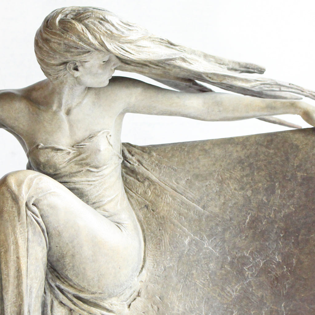 Grace, a limited edition, patinated bronze figure of a dancer in draping robe. Set over a granite plinth.  After completing a Masters degree at the Royal Academy in London 1980, Michael Talbot was led to working under Colin Melbourne ARCA and Dame Elizabeth Frink RA. He was elected to the Royal British Society of Sculptors in 1997.  Signed and numbered edition of 12