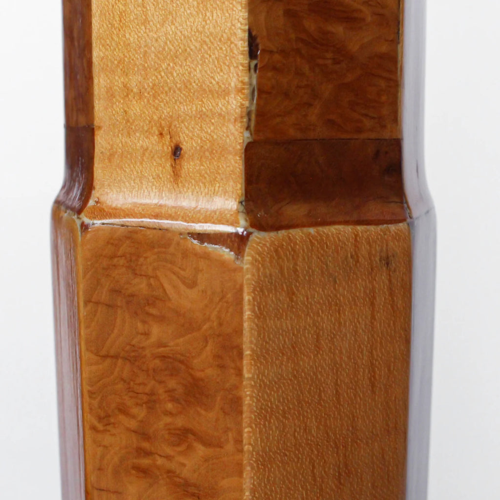 A pair of Art Deco uplighter floor lamps by Harry & Lou Epstein. Made of walnut and satin wood with domed copper shades.