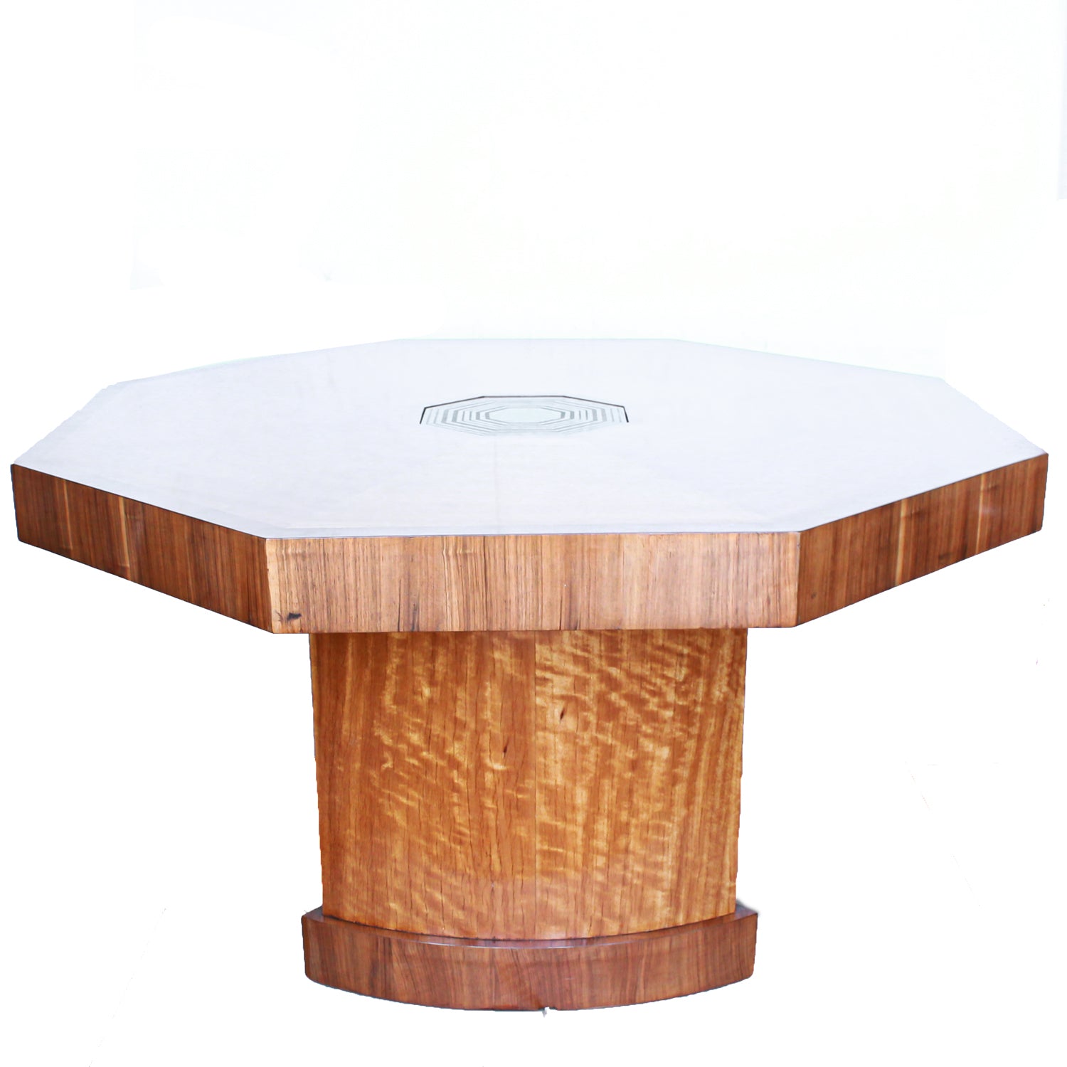 An Art Deco, octagonal dining/centre table in walnut and satin wood veneer with original light in the centre.