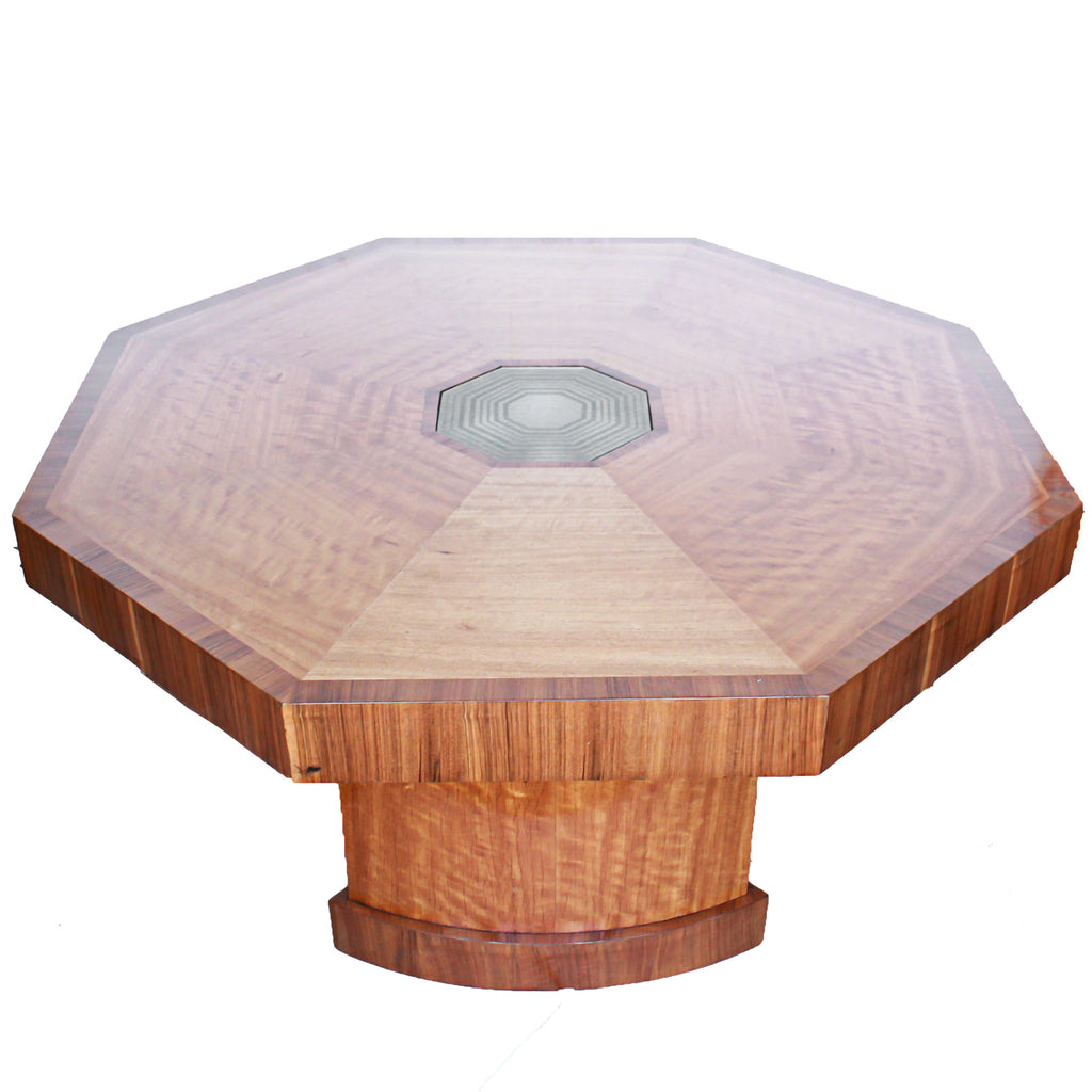 An Art Deco, octagonal dining/centre table in walnut and satin wood veneer with original light in the centre.