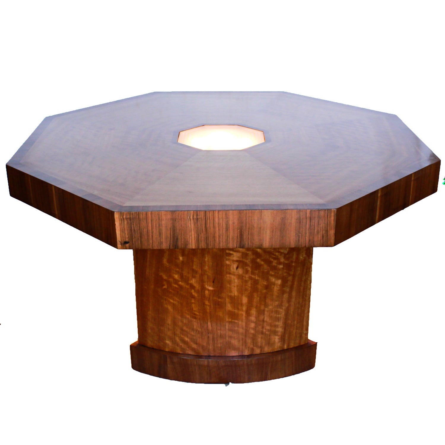 An Art Deco, octagonal dining/centre table in walnut and satin wood veneer with original light in the centre.