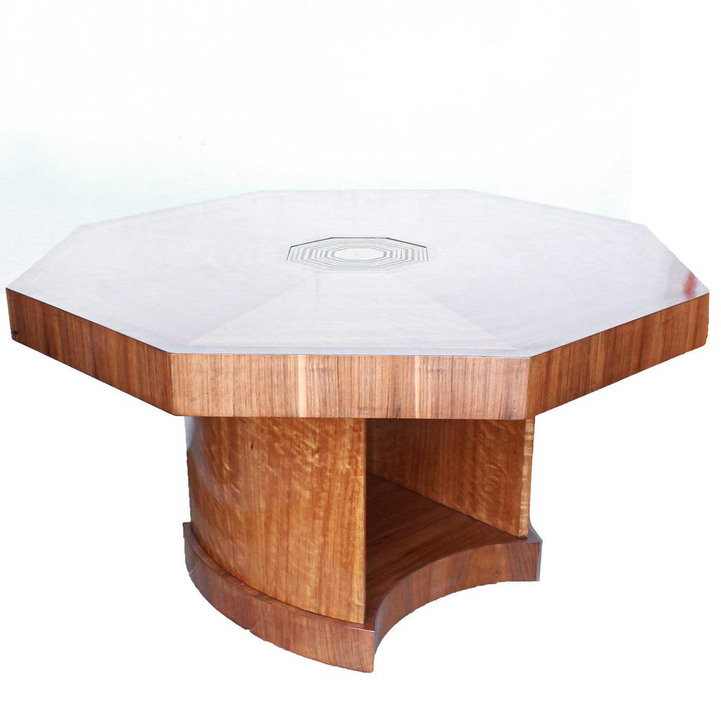 An Art Deco, octagonal dining/centre table in walnut and satin wood veneer with original light in the centre.