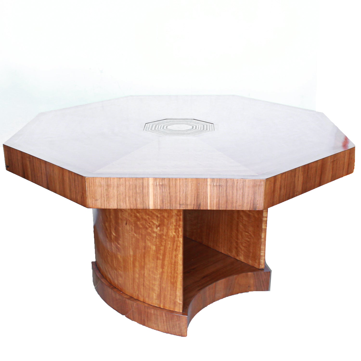An Art Deco, octagonal dining/centre table in walnut and satin wood veneer with original light in the centre.