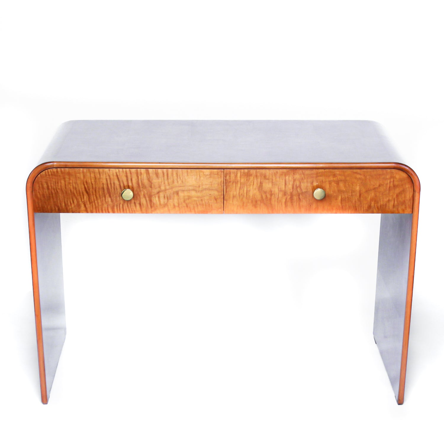 An Art Deco, two drawer desk in satin wood veneer with oak and satin birch drawer linings. Original brass handles.