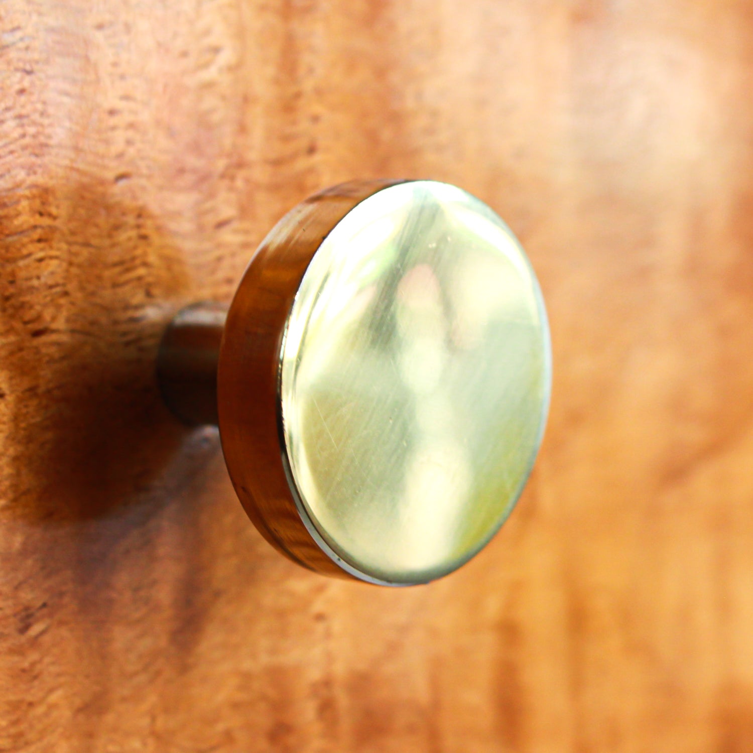 An Art Deco, two drawer desk in satin wood veneer with oak and satin birch drawer linings. Original brass handles.