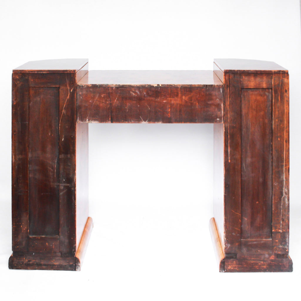 An Art Deco console sideboard by Hille. Burr walnut veneer throughout. Scallop-edged detail to front with integral drawer. Shelved cabinets to either side.