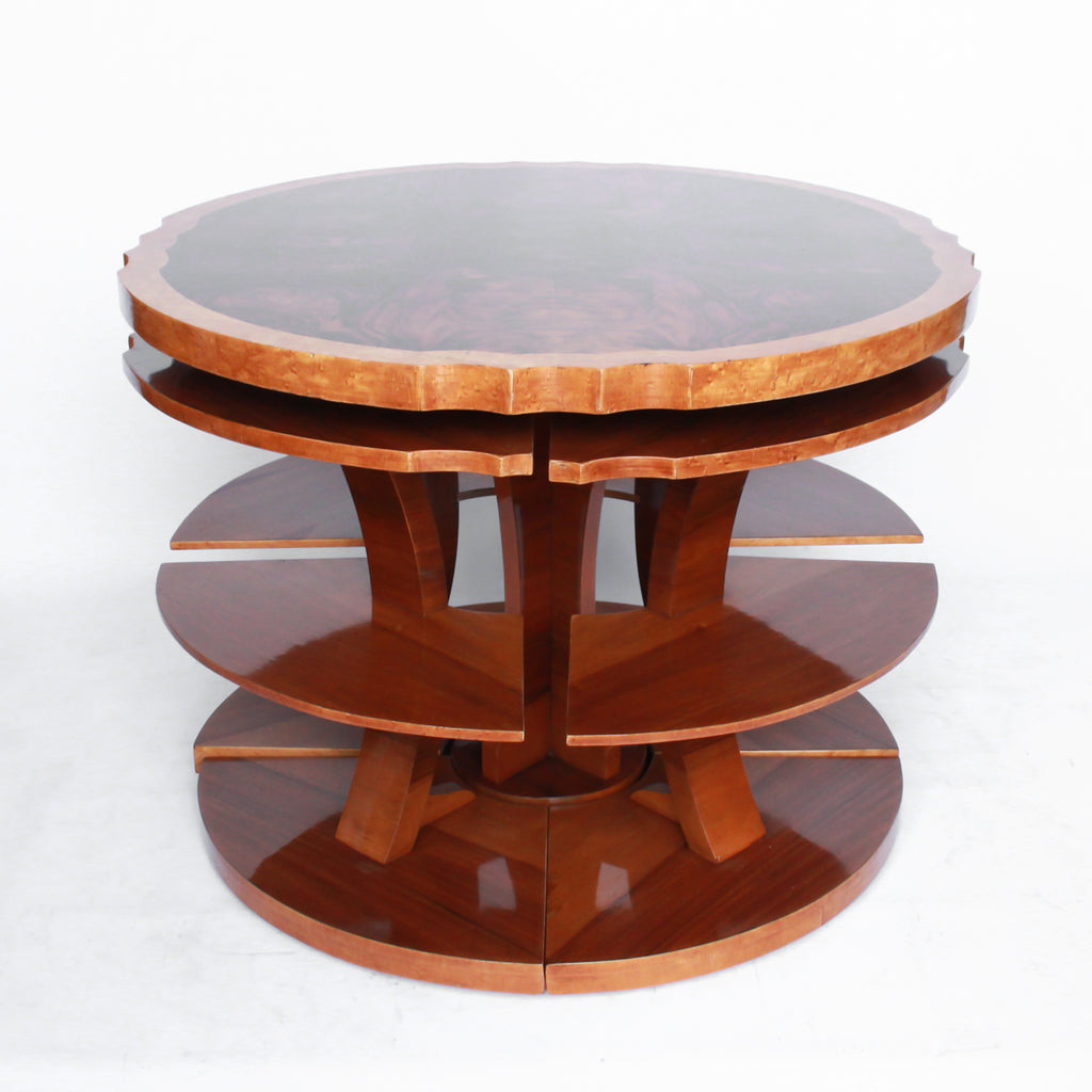 Art Deco, figured walnut veneer nest of tables. A shaped table with cross-footed base and four integral side tables. Burr and straight grain walnut throughout with birdseye maple border.