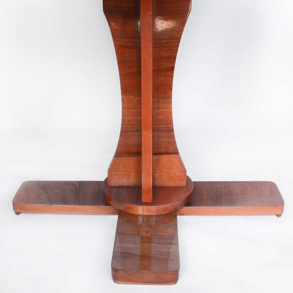 Art Deco, figured walnut veneer nest of tables. A shaped table with cross-footed base and four integral side tables. Burr and straight grain walnut throughout with birdseye maple border.