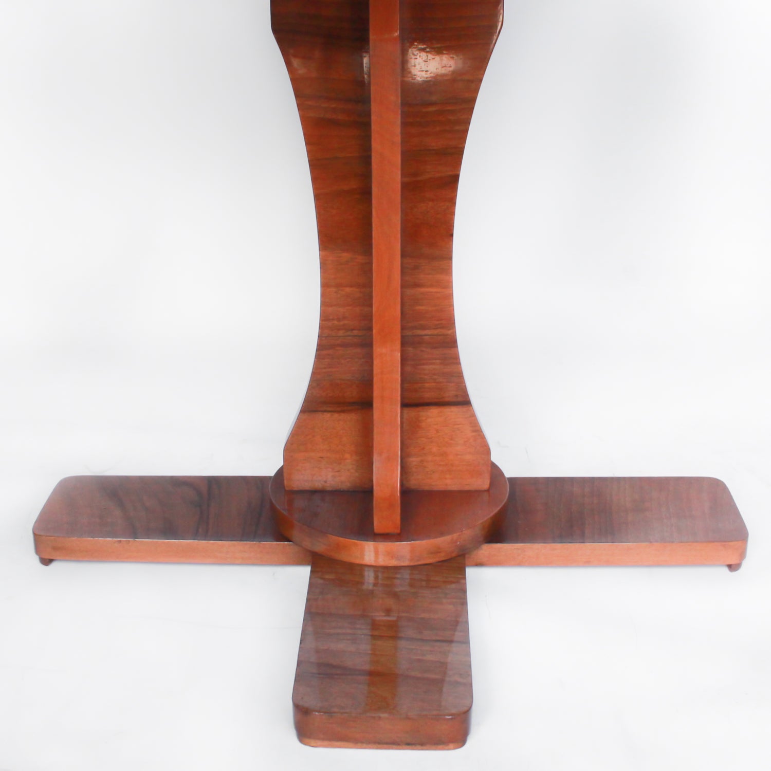 Art Deco, figured walnut veneer nest of tables. A shaped table with cross-footed base and four integral side tables. Burr and straight grain walnut throughout with birdseye maple border.
