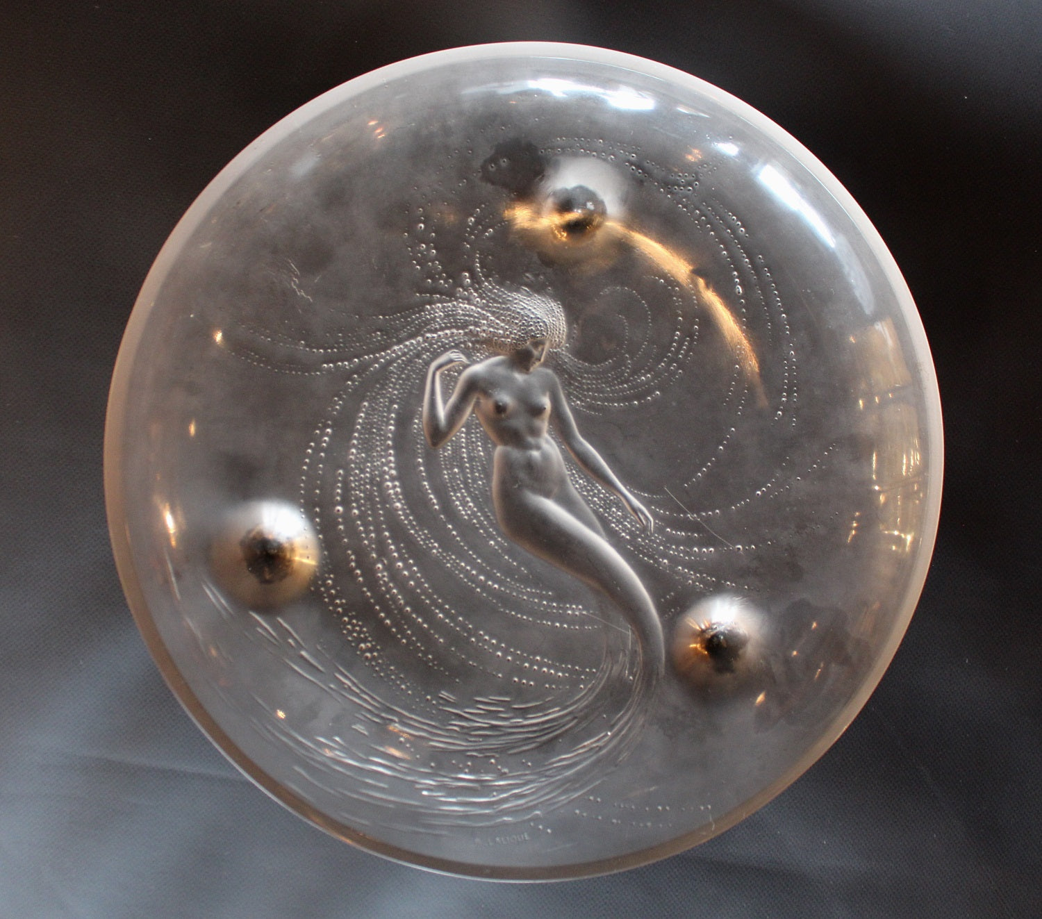 Sirene Coupe  an Art Deco ‘trepied’ glass coupe by Lalique Glass of frosted glass with raised opalescent design in the form of a mermaid frolicking in swirling waters set on three raised feet.