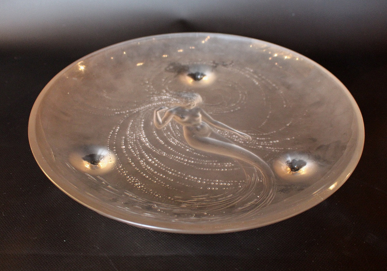 Sirene Coupe  an Art Deco ‘trepied’ glass coupe by Lalique Glass of frosted glass with raised opalescent design in the form of a mermaid frolicking in swirling waters set on three raised feet.