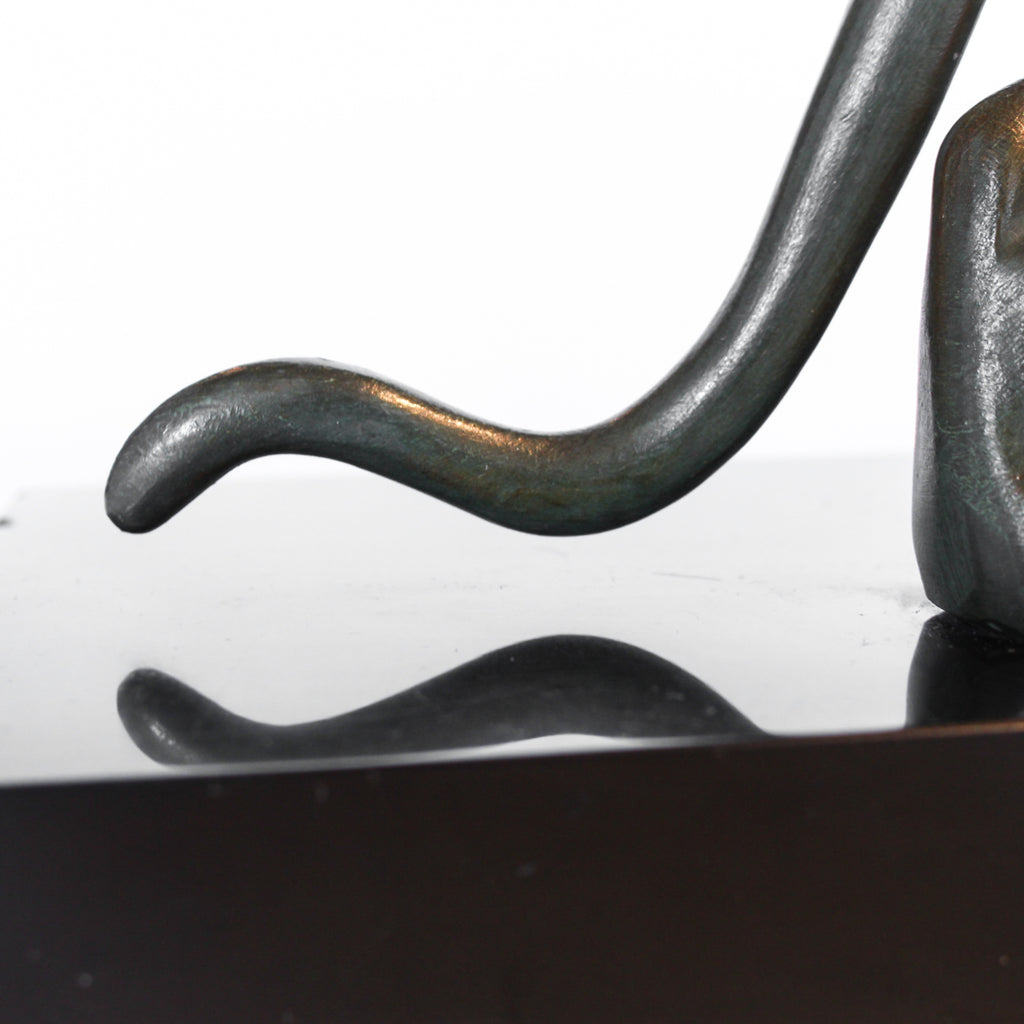 An Art Deco, patinated bronze study of a prowling lioness, mounted on a black marble base. Signed 'M. Leduc' at Jeroen Markies.