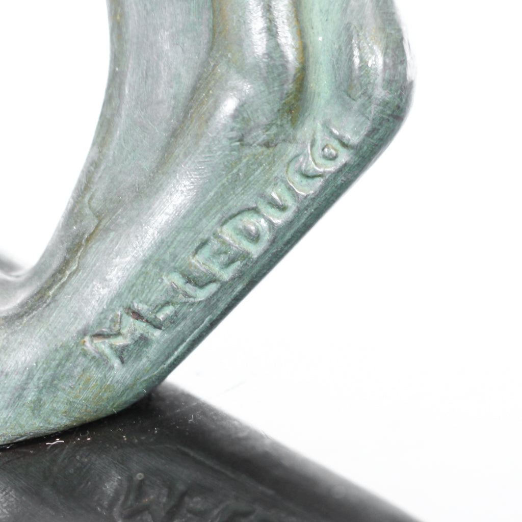 An Art Deco, patinated bronze study of a prowling lioness, mounted on a black marble base. Signed 'M. Leduc' at Jeroen Markies.