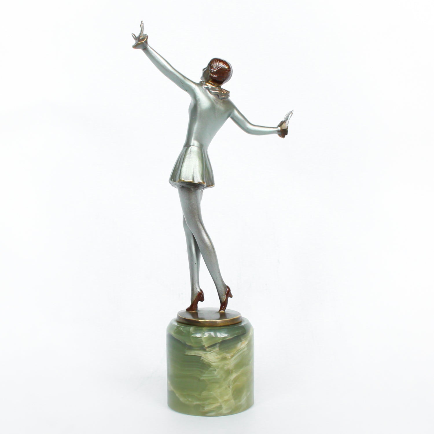 An Art Deco, cold painted bronze figure of an elegant dancer in a striking pose, raised on a green onyx base.  Signed Lorenzl to bronze