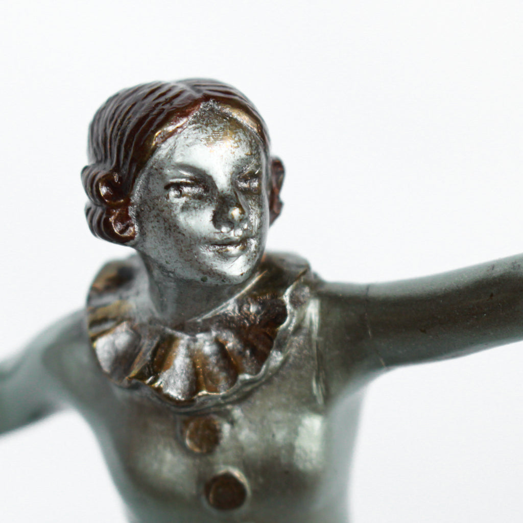 An Art Deco, cold painted bronze figure of an elegant dancer in a striking pose, raised on a green onyx base.  Signed Lorenzl to bronze