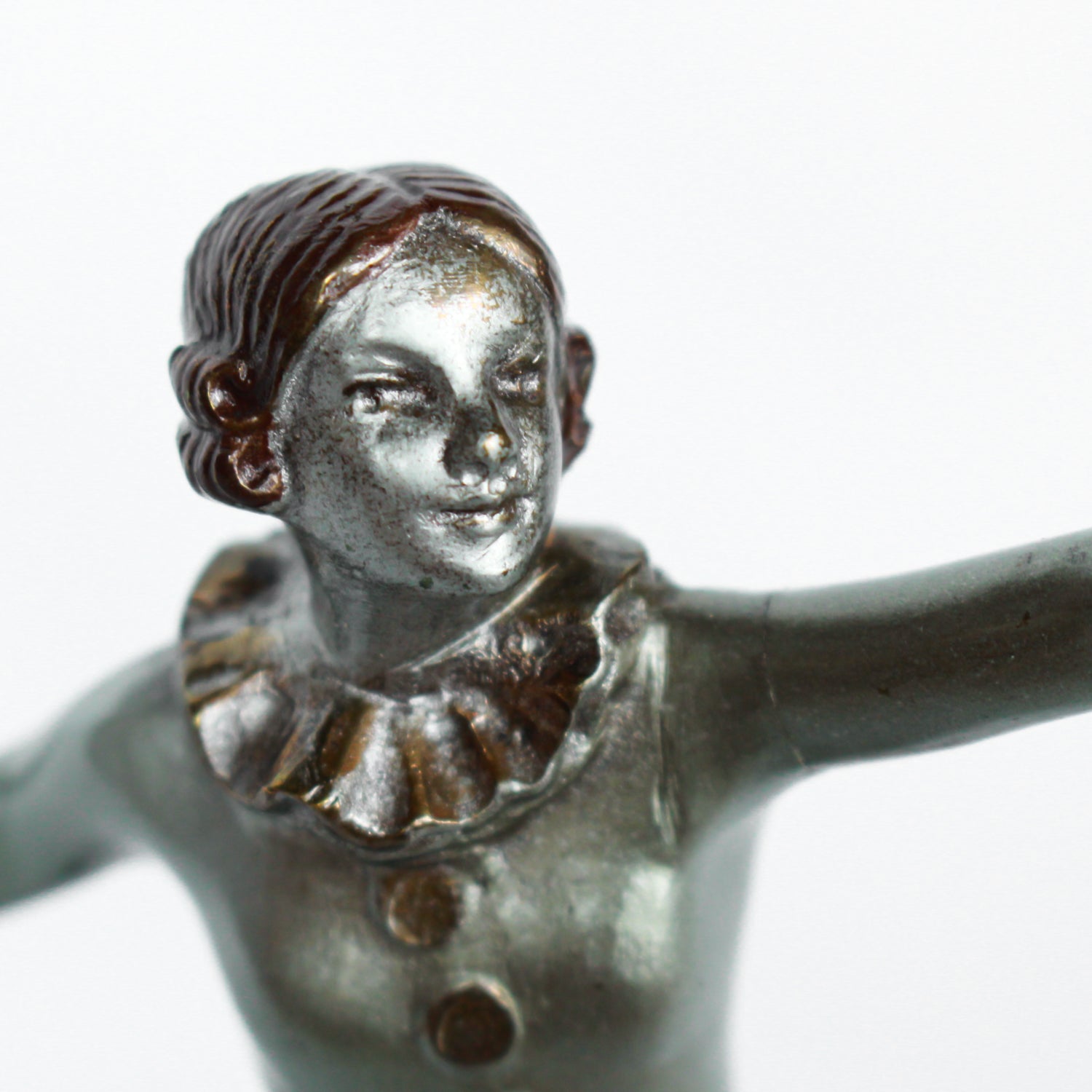 An Art Deco, cold painted bronze figure of an elegant dancer in a striking pose, raised on a green onyx base.  Signed Lorenzl to bronze