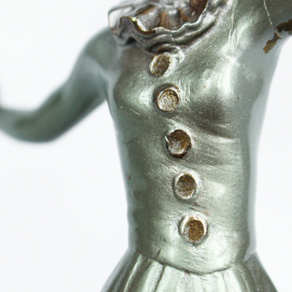 An Art Deco, cold painted bronze figure of an elegant dancer in a striking pose, raised on a green onyx base.  Signed Lorenzl to bronze