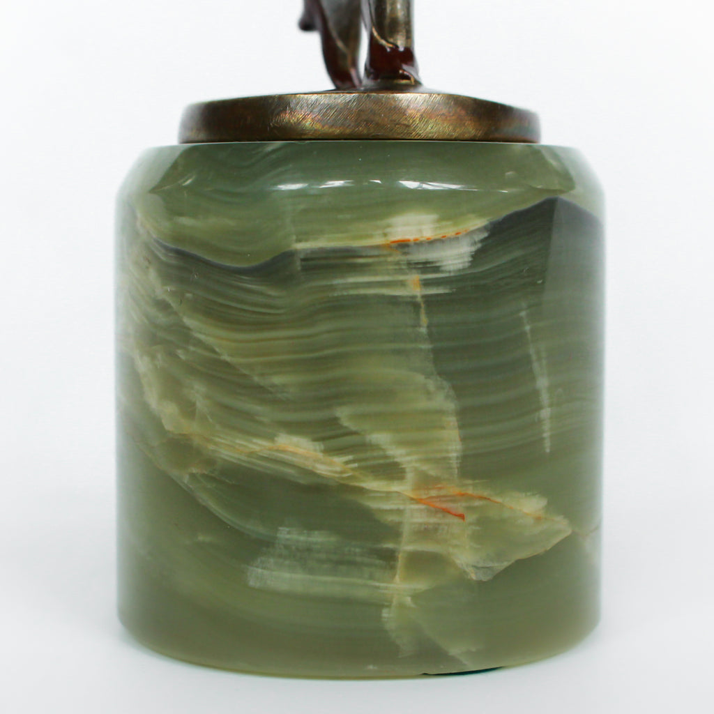 An Art Deco, cold painted bronze figure of an elegant dancer in a striking pose, raised on a green onyx base.  Signed Lorenzl to bronze