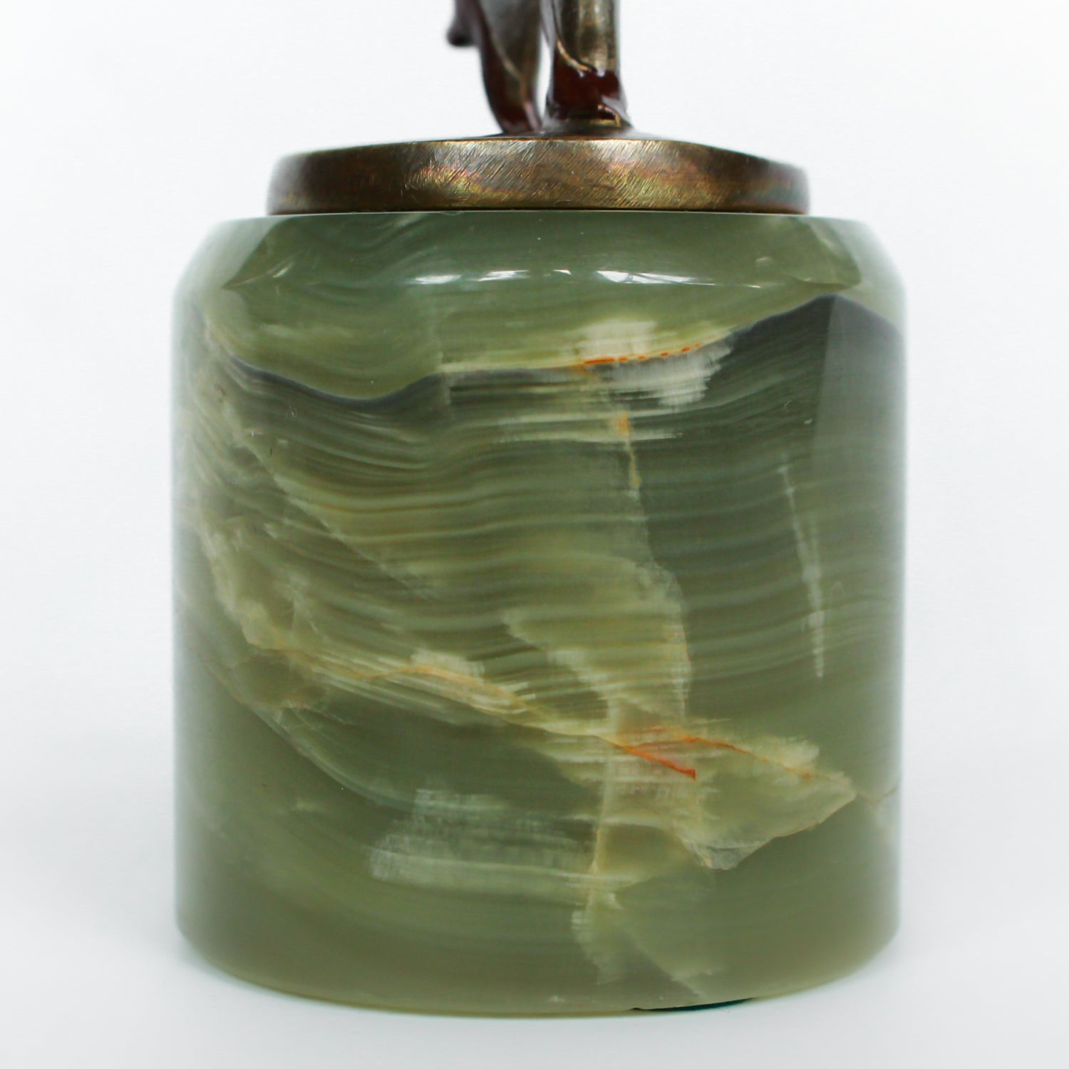 An Art Deco, cold painted bronze figure of an elegant dancer in a striking pose, raised on a green onyx base.  Signed Lorenzl to bronze