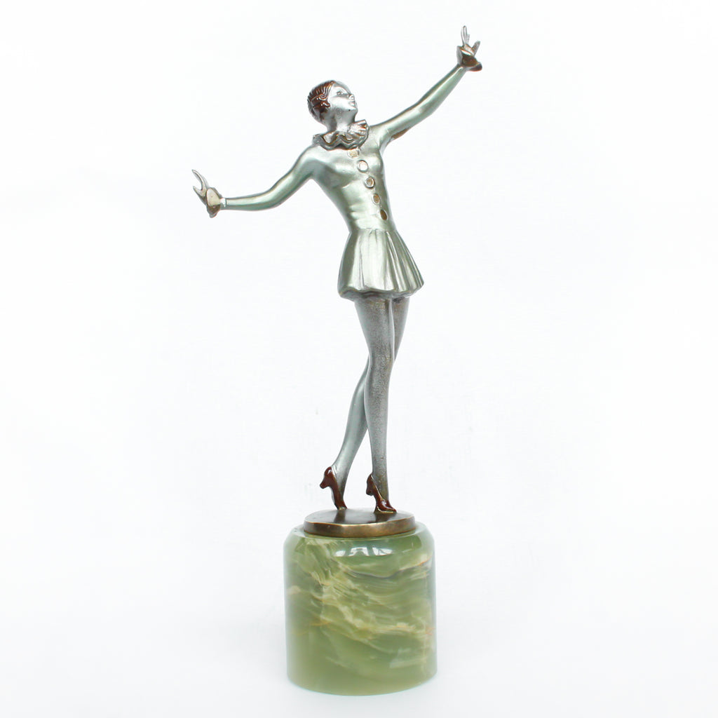 An Art Deco, cold painted bronze figure of an elegant dancer in a striking pose, raised on a green onyx base.  Signed Lorenzl to bronze