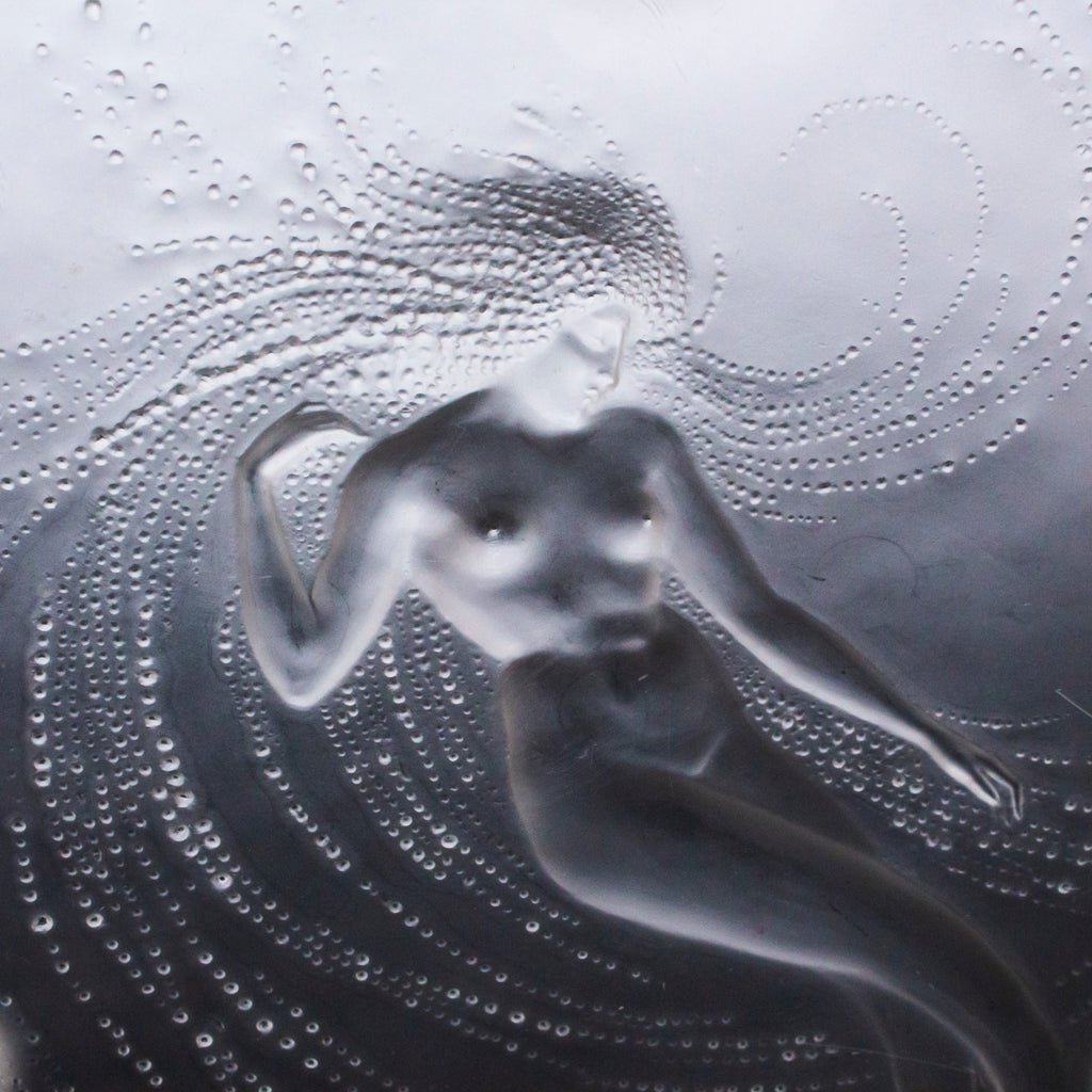 Sirene Coupe  an Art Deco ‘trepied’ glass coupe by Lalique Glass of frosted glass with raised opalescent design in the form of a mermaid frolicking in swirling waters set on three raised feet.