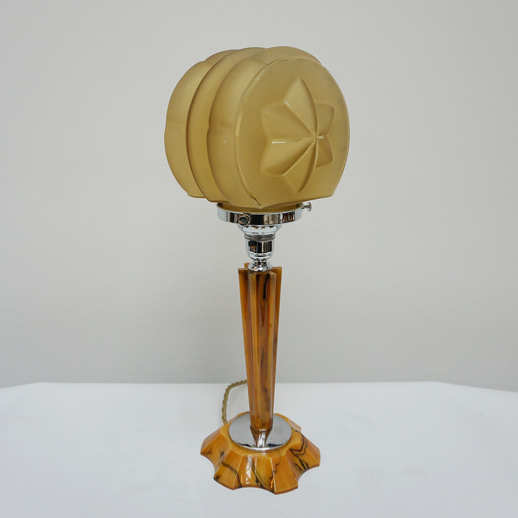 An Art Deco table lamp. Marbled amber bakelite base and stem inset with chrome. Yellow glass circular shade - Jeroen Markies Art Deco