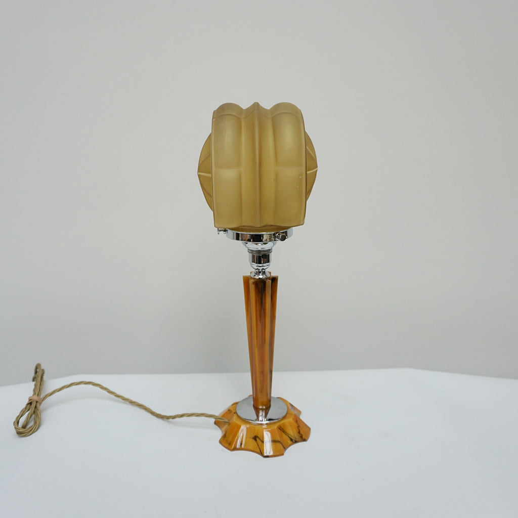 An Art Deco table lamp. Marbled amber bakelite base and stem inset with chrome. Yellow glass circular shade - Jeroen Markies Art Deco