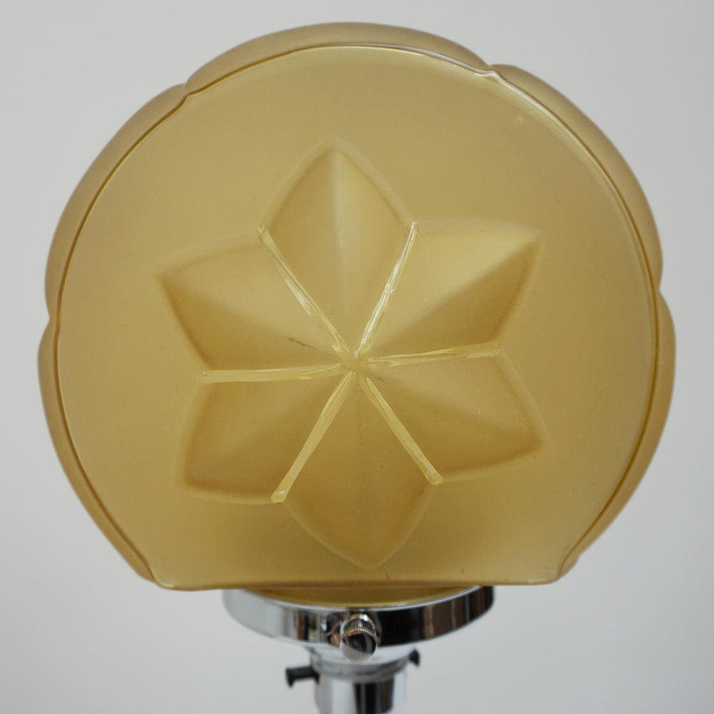 An Art Deco table lamp. Marbled amber bakelite base and stem inset with chrome. Yellow glass circular shade - Jeroen Markies Art DecoAn Art Deco table lamp. Marbled amber bakelite base and stem inset with chrome. Yellow glass circular shade - Jeroen Markies Art Deco