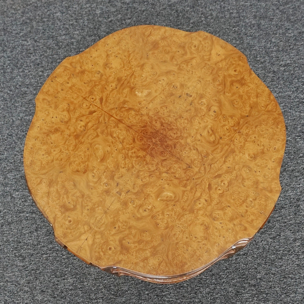 An Art Deco nest of tables by Harry & Lou Epstein Burr walnut veneered. Consisting of a central coffee table with four shelved pull out side tables. The tables have glass tops.