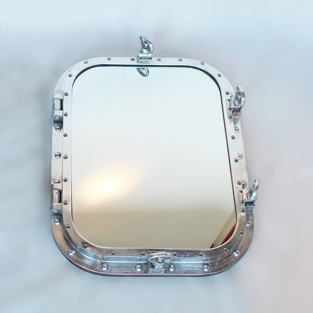 Art Deco porthole transformed into opening mirror at Jeroen Markies