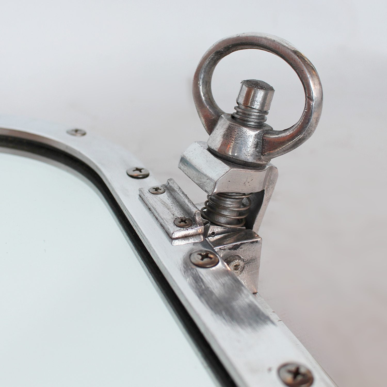 Art Deco porthole transformed into opening mirror at Jeroen Markies