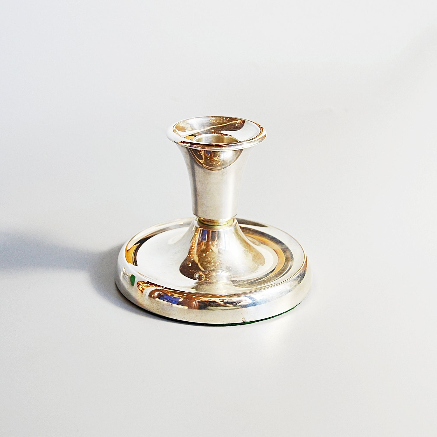A Pair of Silver Dwarf Candlesticks