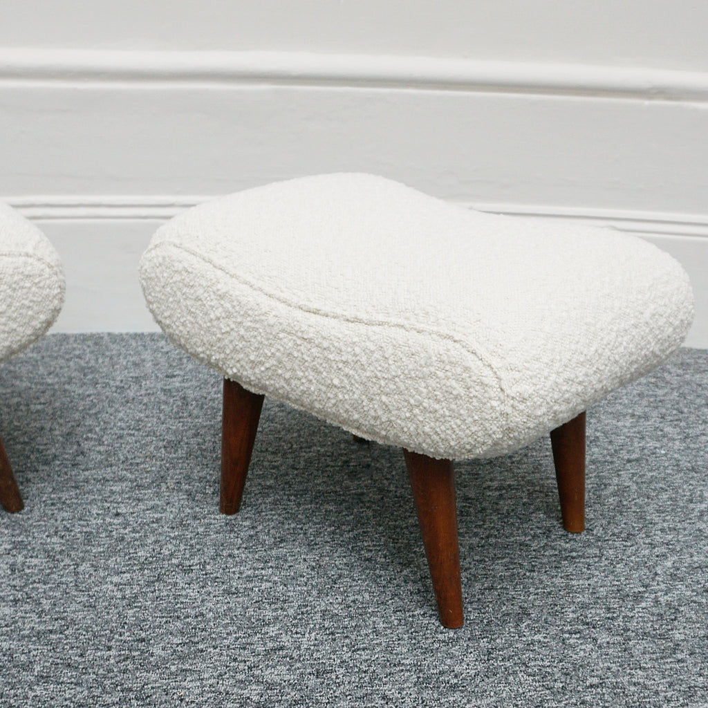  A Pair of Mid Century Footstools  re-upholstered in white Bouclé with tapered teak feet