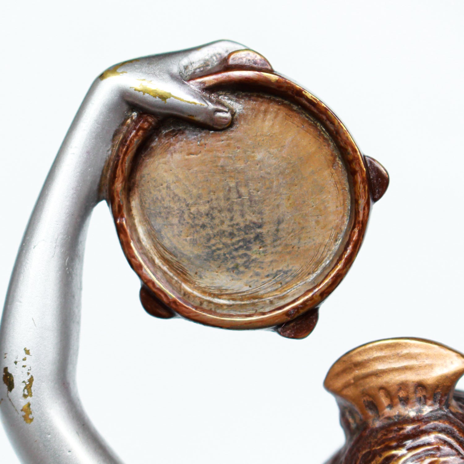 An Art Deco, cold painted bronze figure of an elegant dancer holding a tambourine, raised on a green onyx base.  Signed Lorenzl to bronze