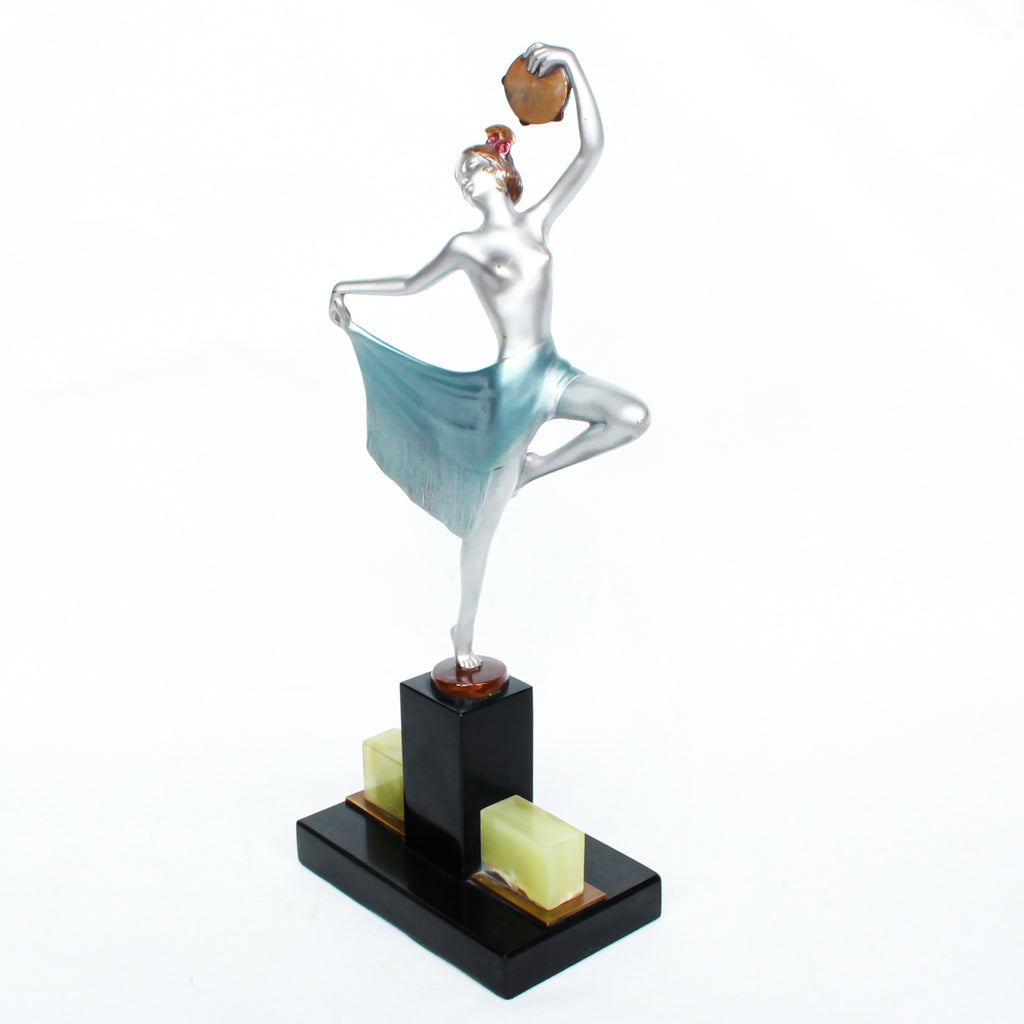 An Art Deco, cold painted bronze figure of an elegant dancer holding a tambourine, raised on a green onyx base.  Signed Lorenzl to bronze