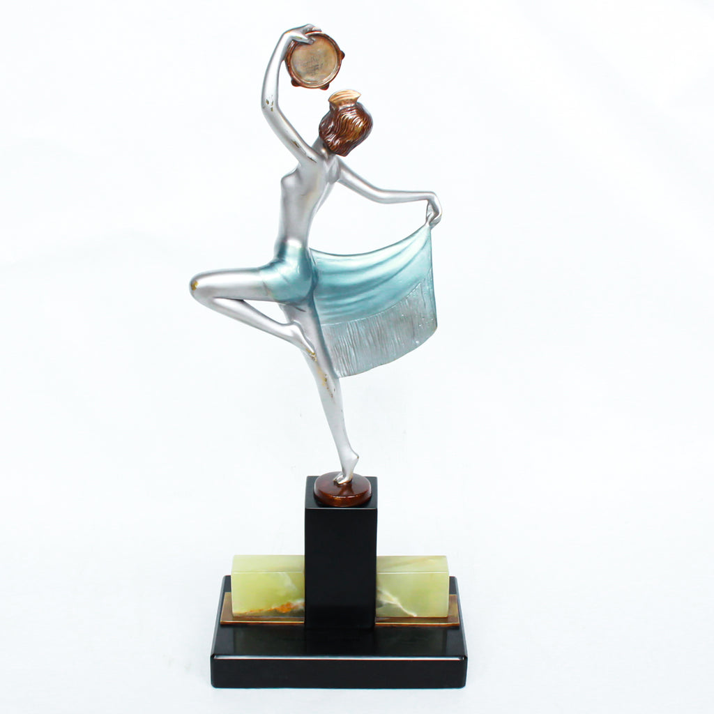 An Art Deco, cold painted bronze figure of an elegant dancer holding a tambourine, raised on a green onyx base.  Signed Lorenzl to bronze
